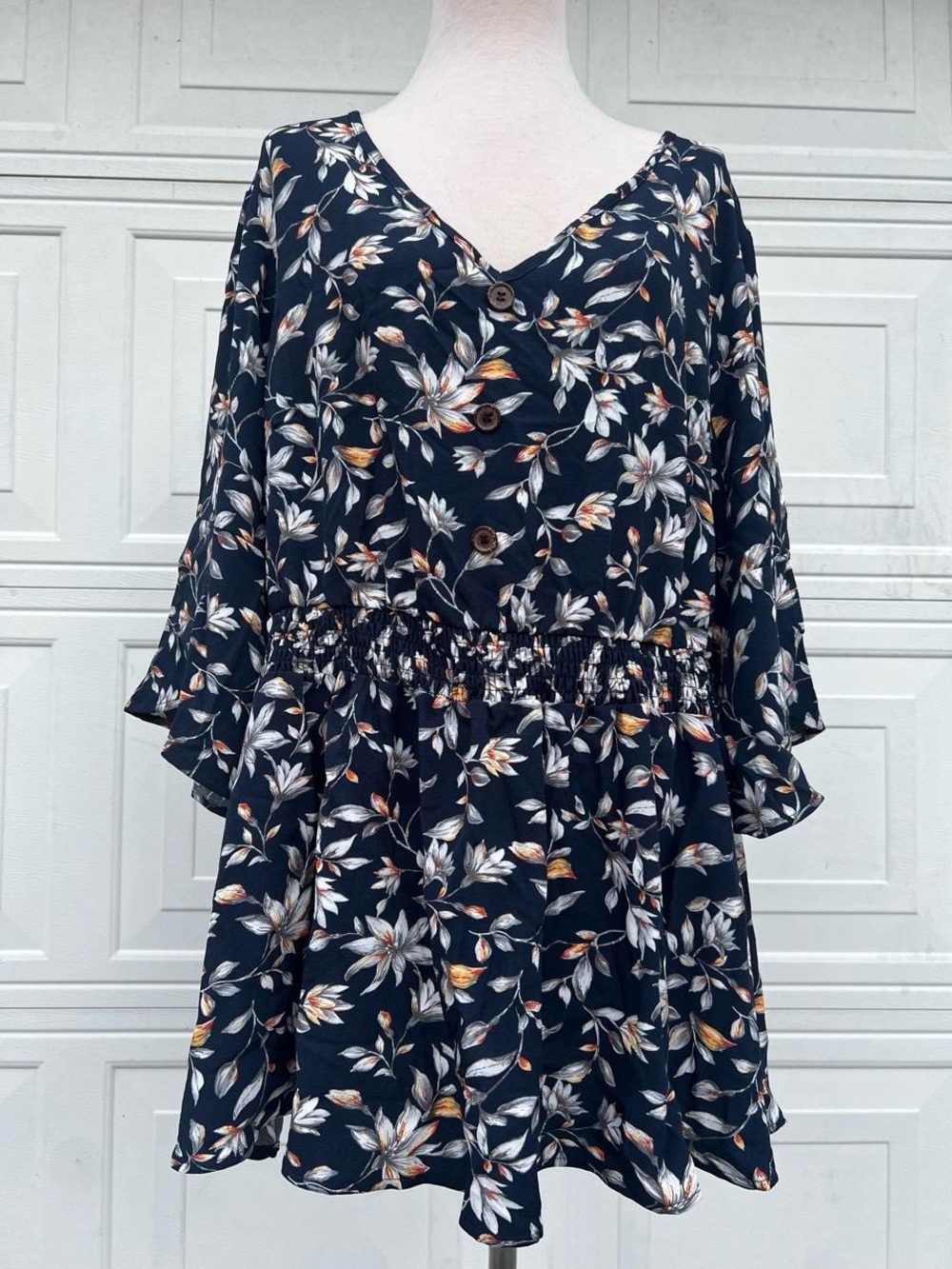 BloomChic Navy Floral Button-Front blouse.